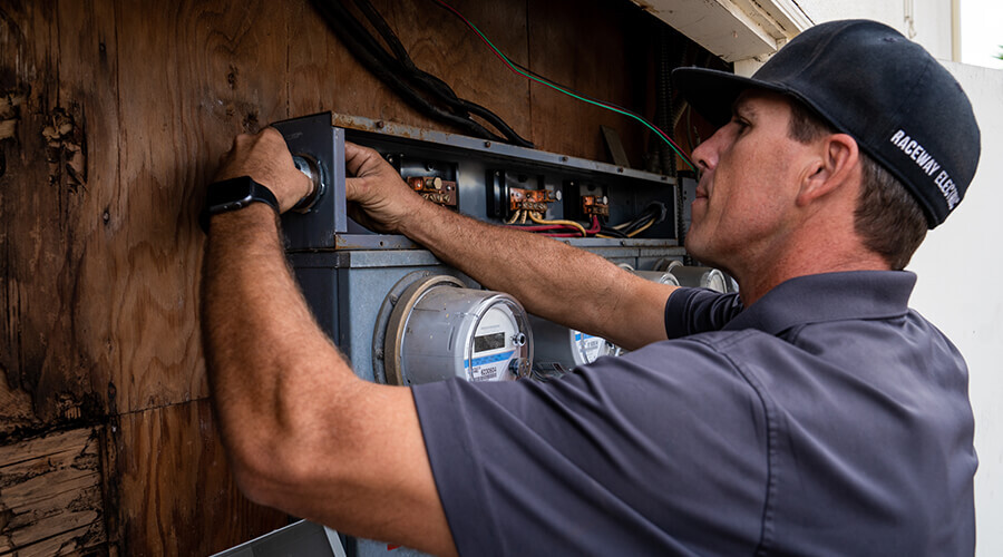 Man Fixing electrical wiring. 