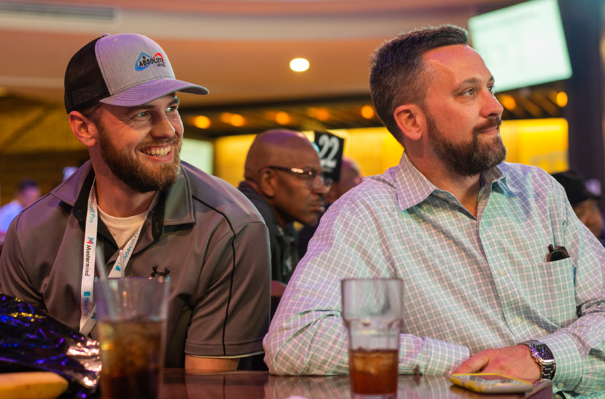 Two pros sitting together at a conference