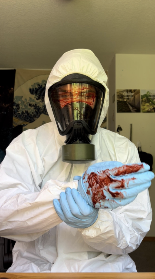 - Housecall Pro Jacob Suarez in white hazmat suit