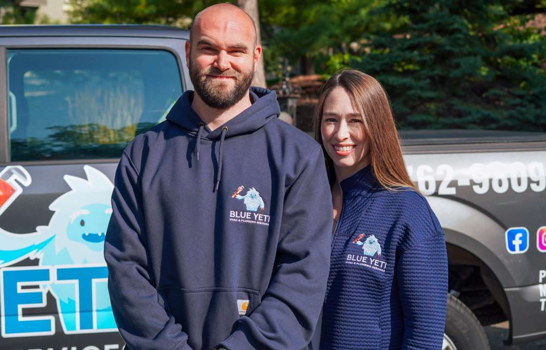 Owners of Blue Yeti Services in front of their truck
