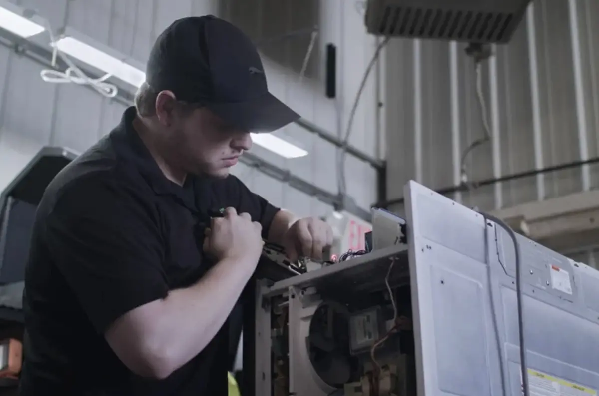 Pro repairing appliance in warehouse