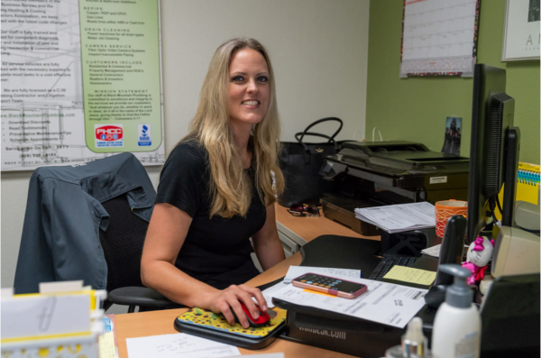 Woman smiling sitting at desk