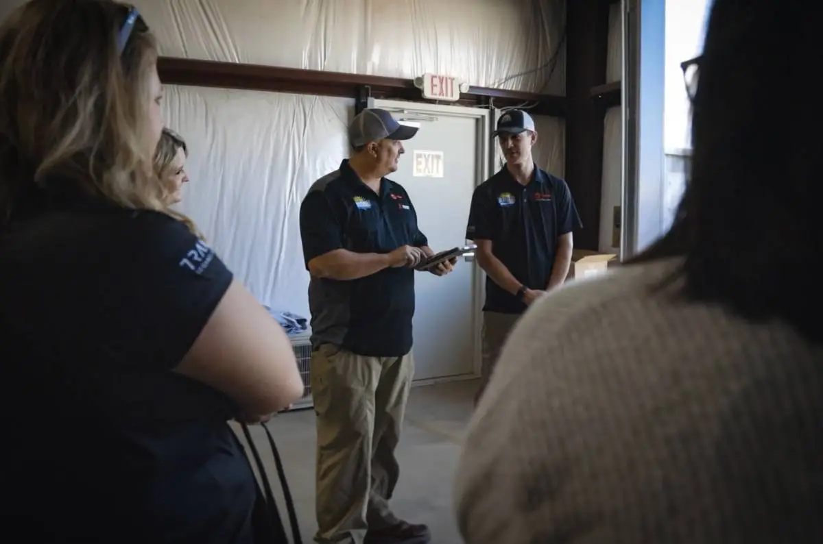 HVAC team huddle at warehouse