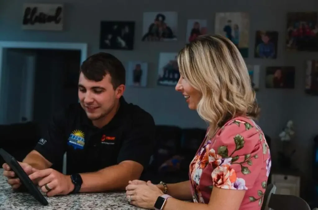 Pro provides excellent customer service to blonde female customer