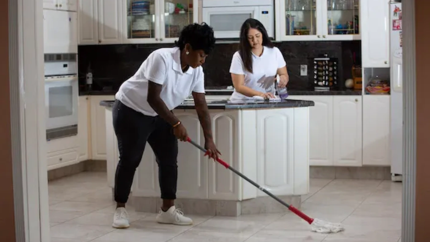 - Housecall Pro two female home cleaning pros at work in kitchen