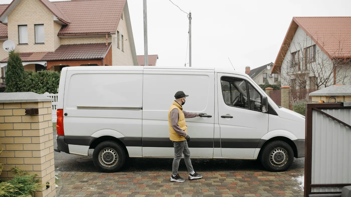 man opening door of van