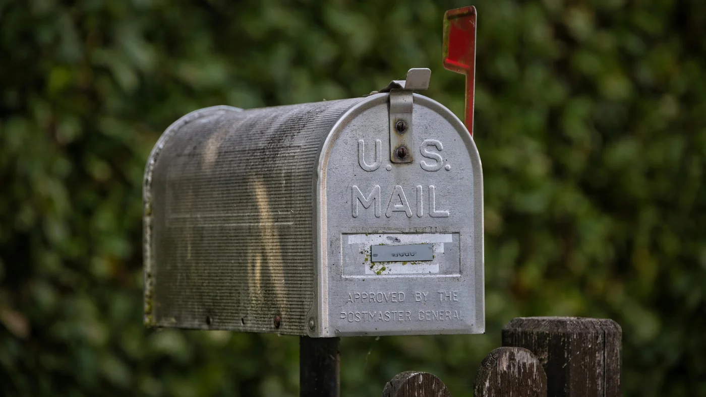 outdoor mailbox standing near a house