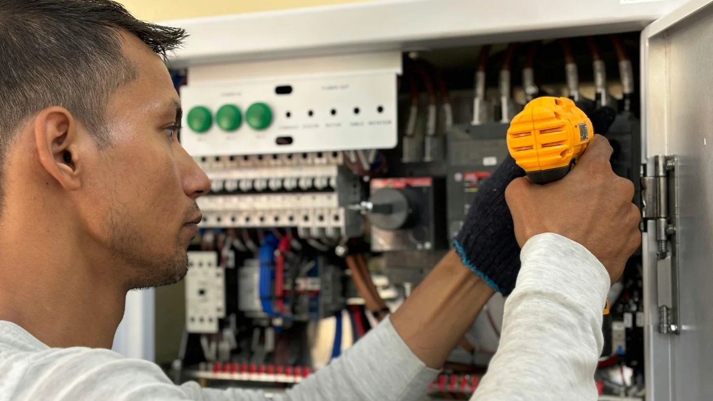 Pro electrician working on an electrical panel