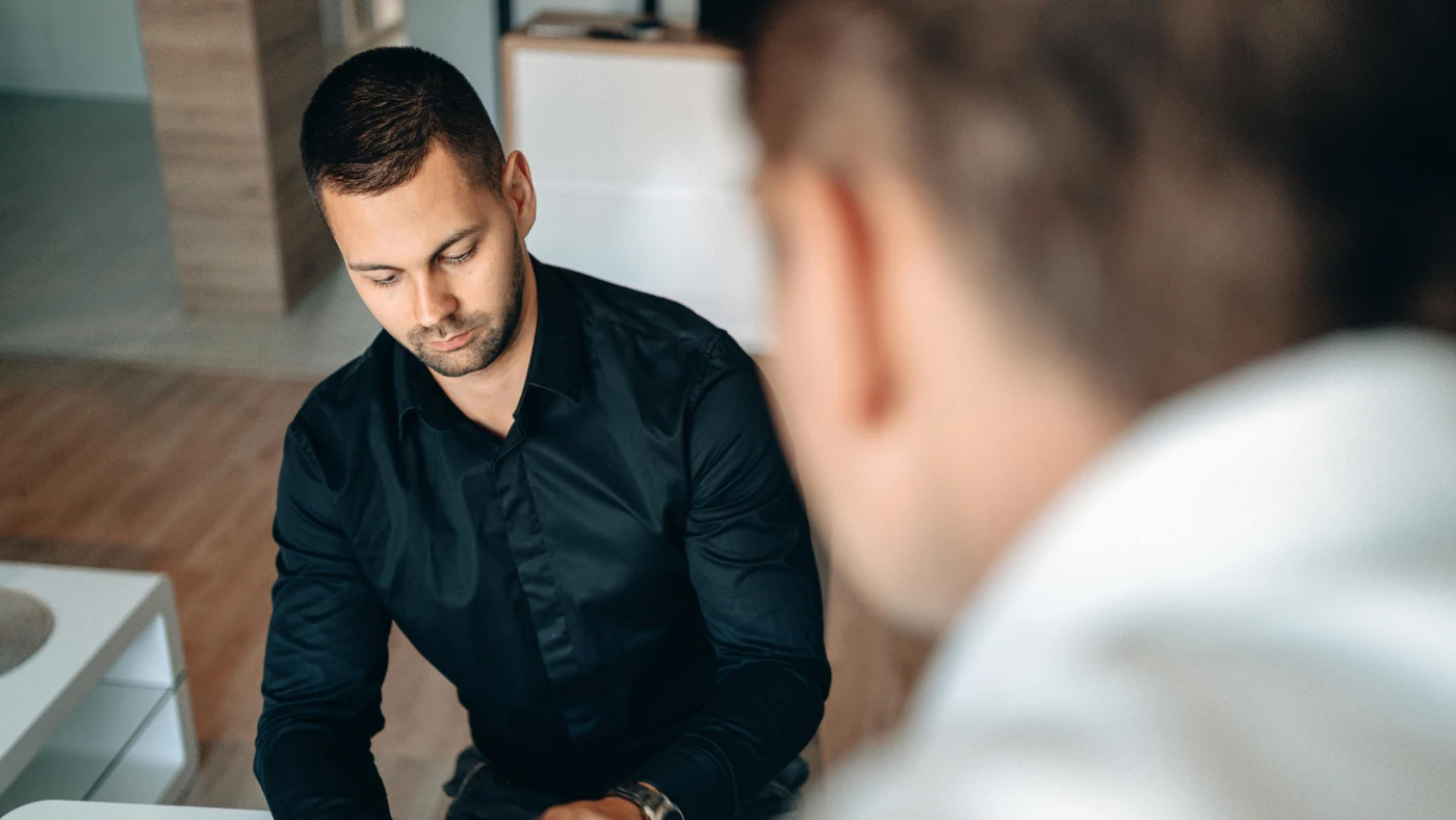 Business owner discussing payment terms during client meeting