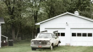 Pickup truck parked outside garage, representing business opportunities for truck owners
