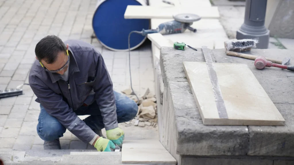 Pro worker working on outdoor stone installation