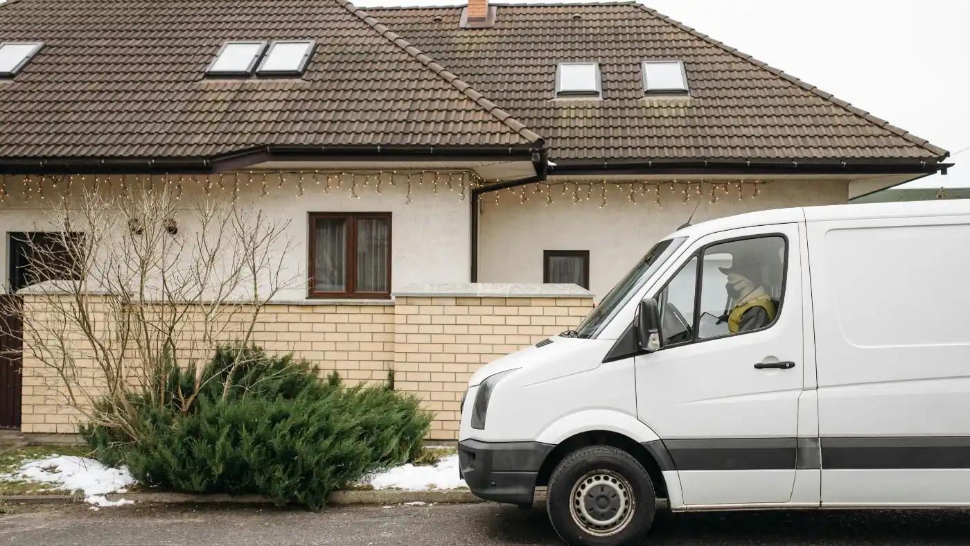 Service van parked outside home, representing defined service areas for local businesses