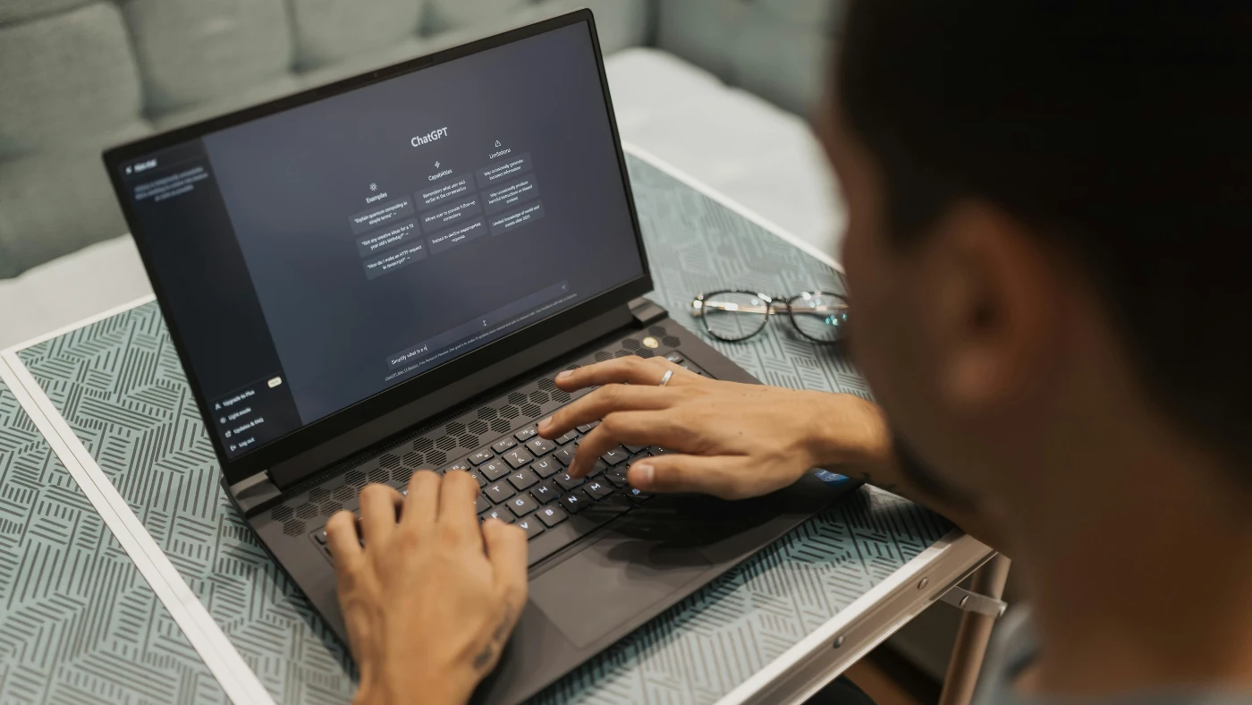 man using chatGPT tool on his laptop