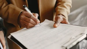 Handyman reviewing and signing home repair service contract