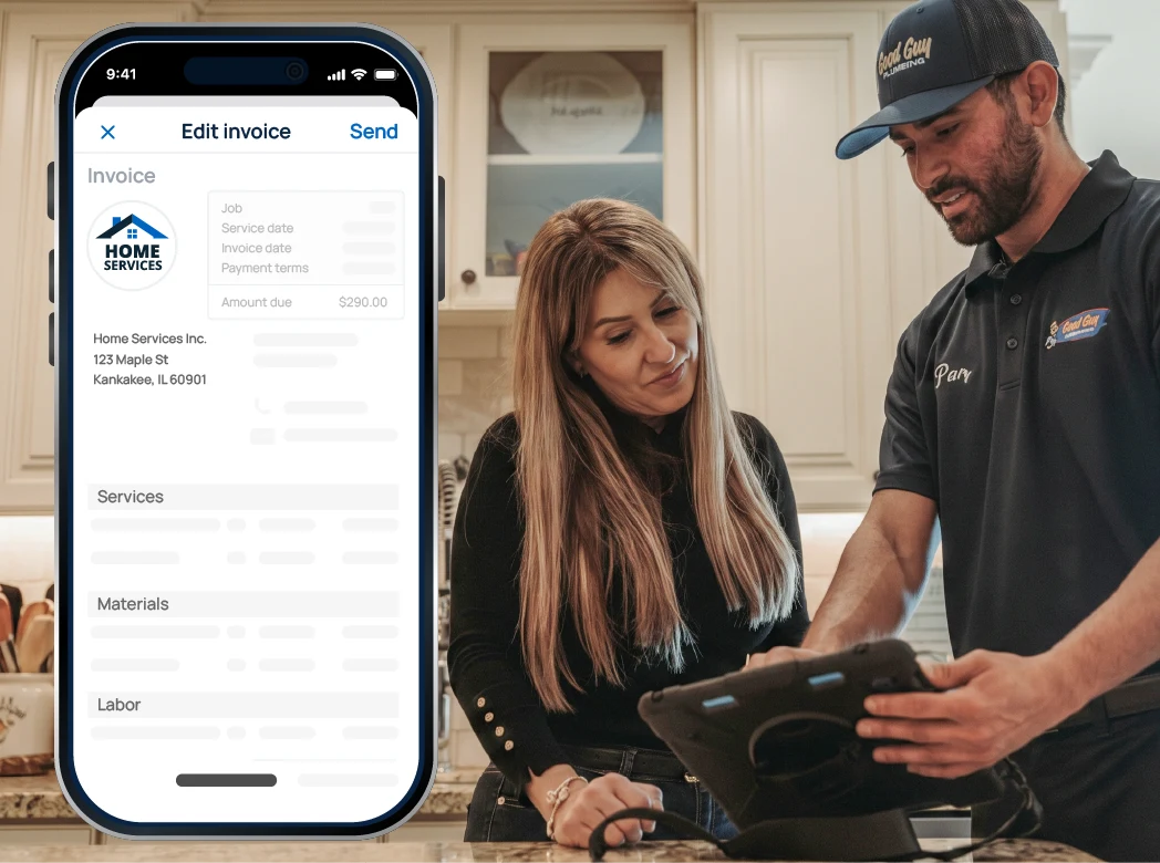 Customer and technician review an invoice on a tablet in a kitchen, with a large phone screen showing the invoice app.